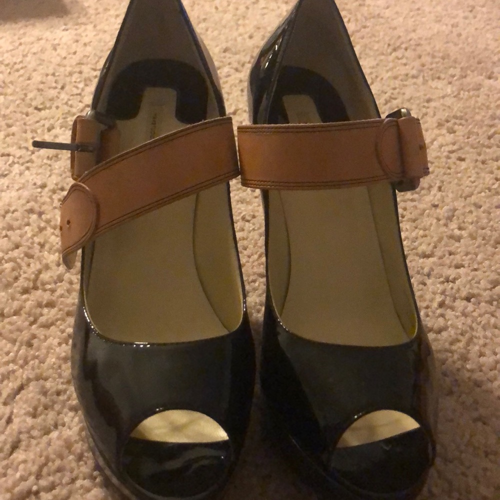 Black patent leather platform shoe.